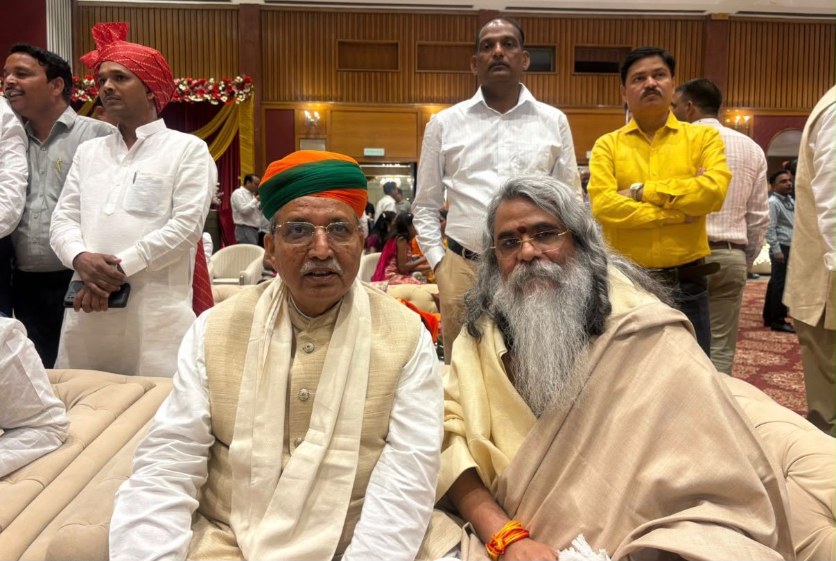 Maharishi Yogi Madhusudan Ji beside a senior Union Minister during the wedding function
